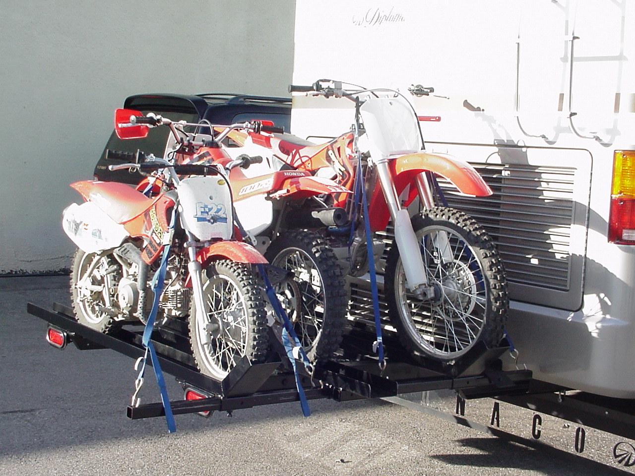 Heavy-duty custom hitch rack designed to carry three motorcycles.