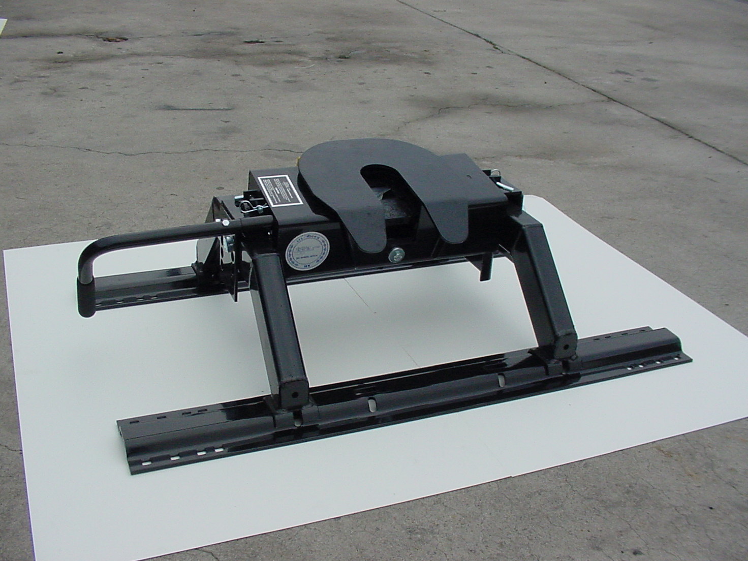 Custom made under-bed mounting brackets for a gooseneck hitch installation.