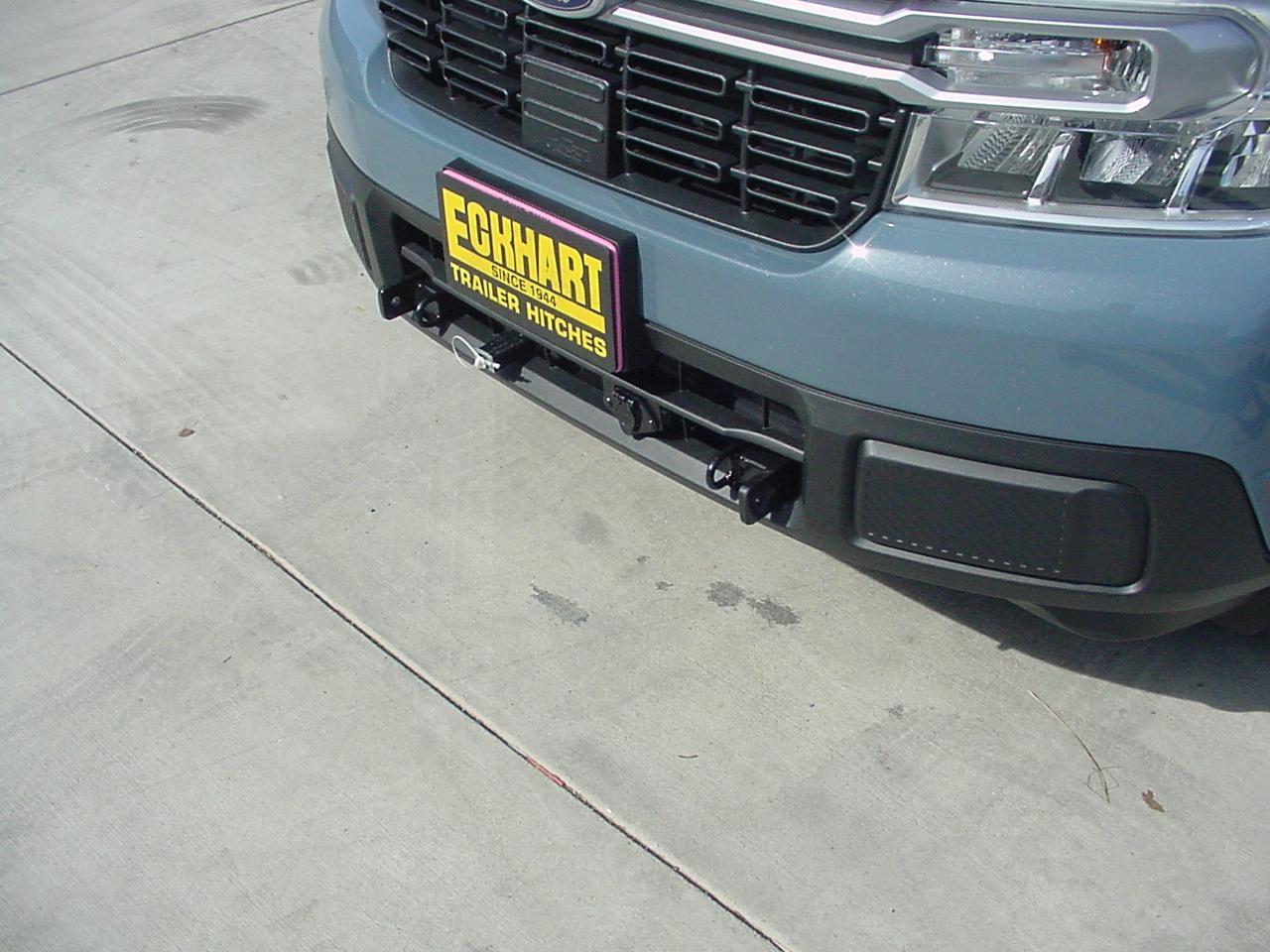 Custom tow bar base plate brackets cleanly installed on a Ford Maverick.