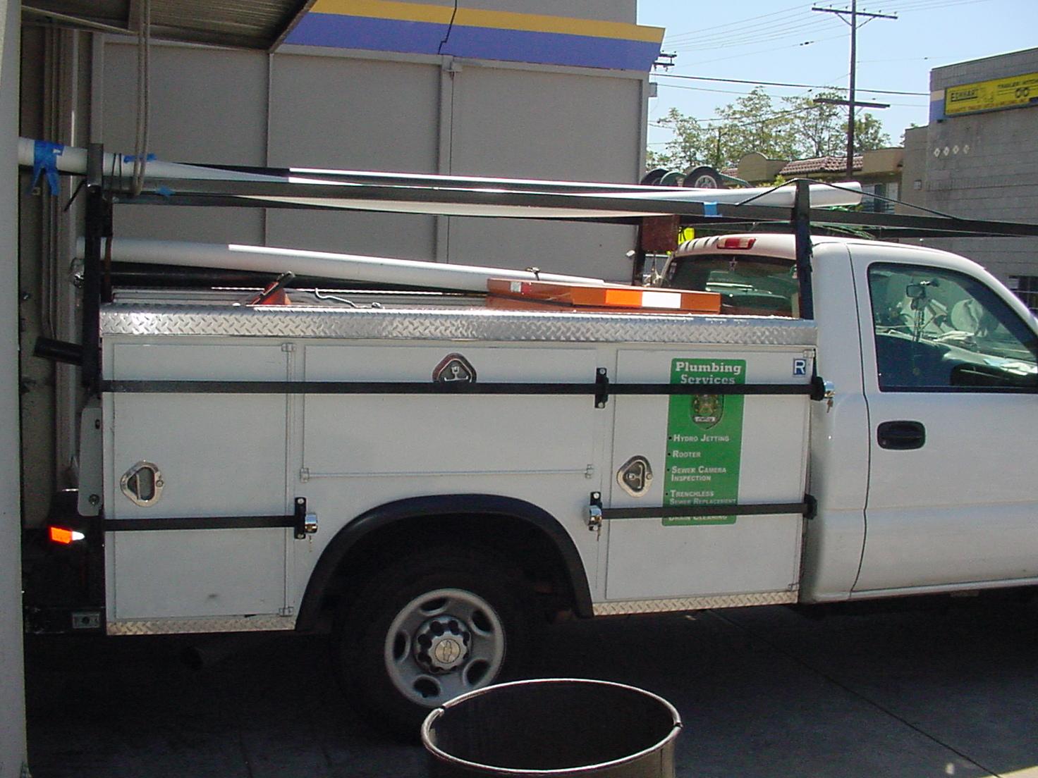 Custom-welded security cage bars for commercial vehicle protection.