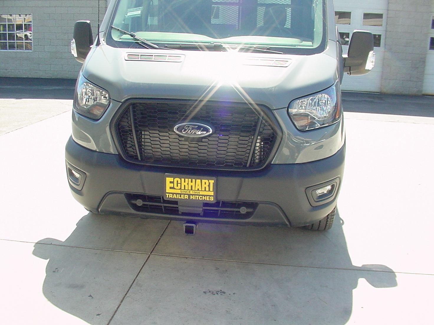 Front-mount hitch installed on a Ford Transit van for extra cargo and utility.