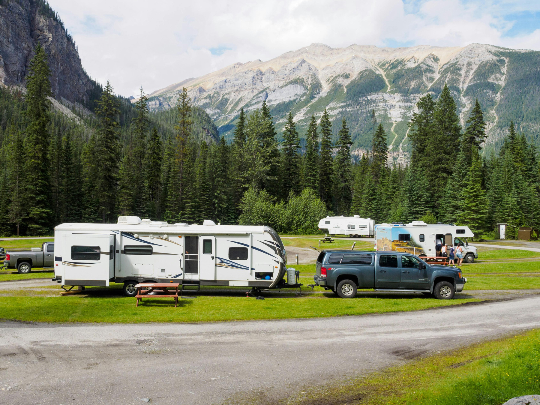Comprehensive Trailer Repair Services provided by Eckharts in Oxnard. Truck towing a camping trailer in national park.