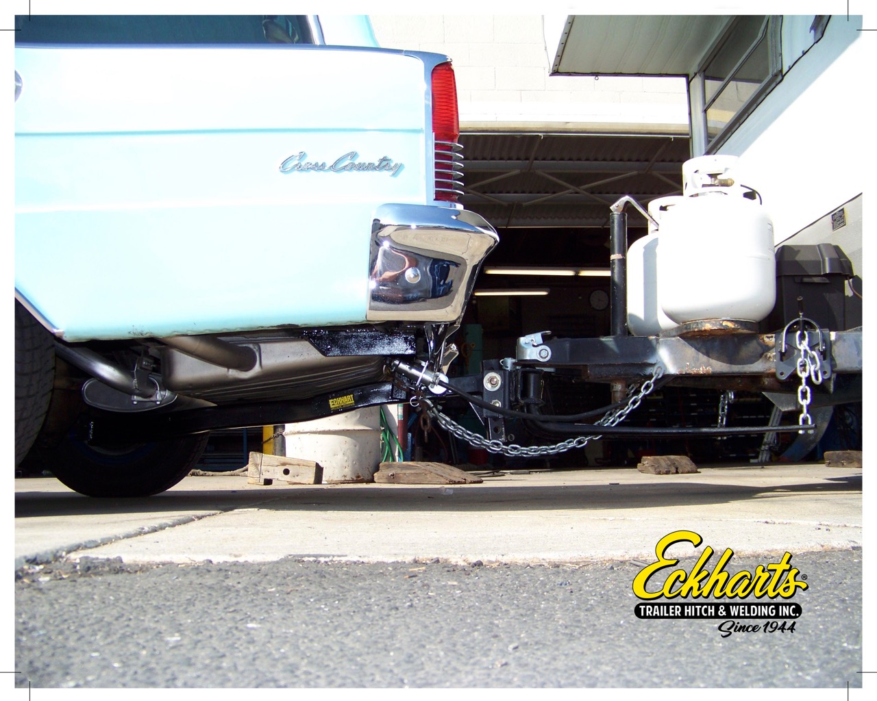 Vintage Rambler car safely towing a trailer using a custom Eckharts hitch.